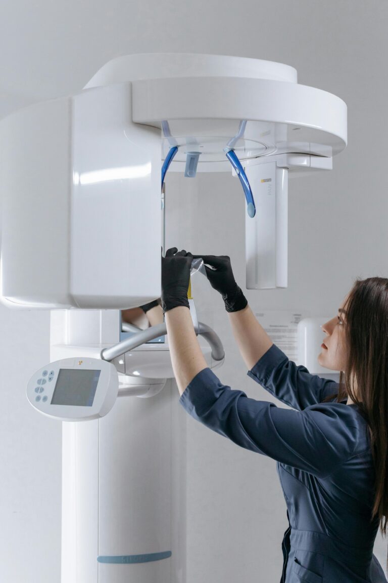 A Woman Using a Dental X-ray Machine